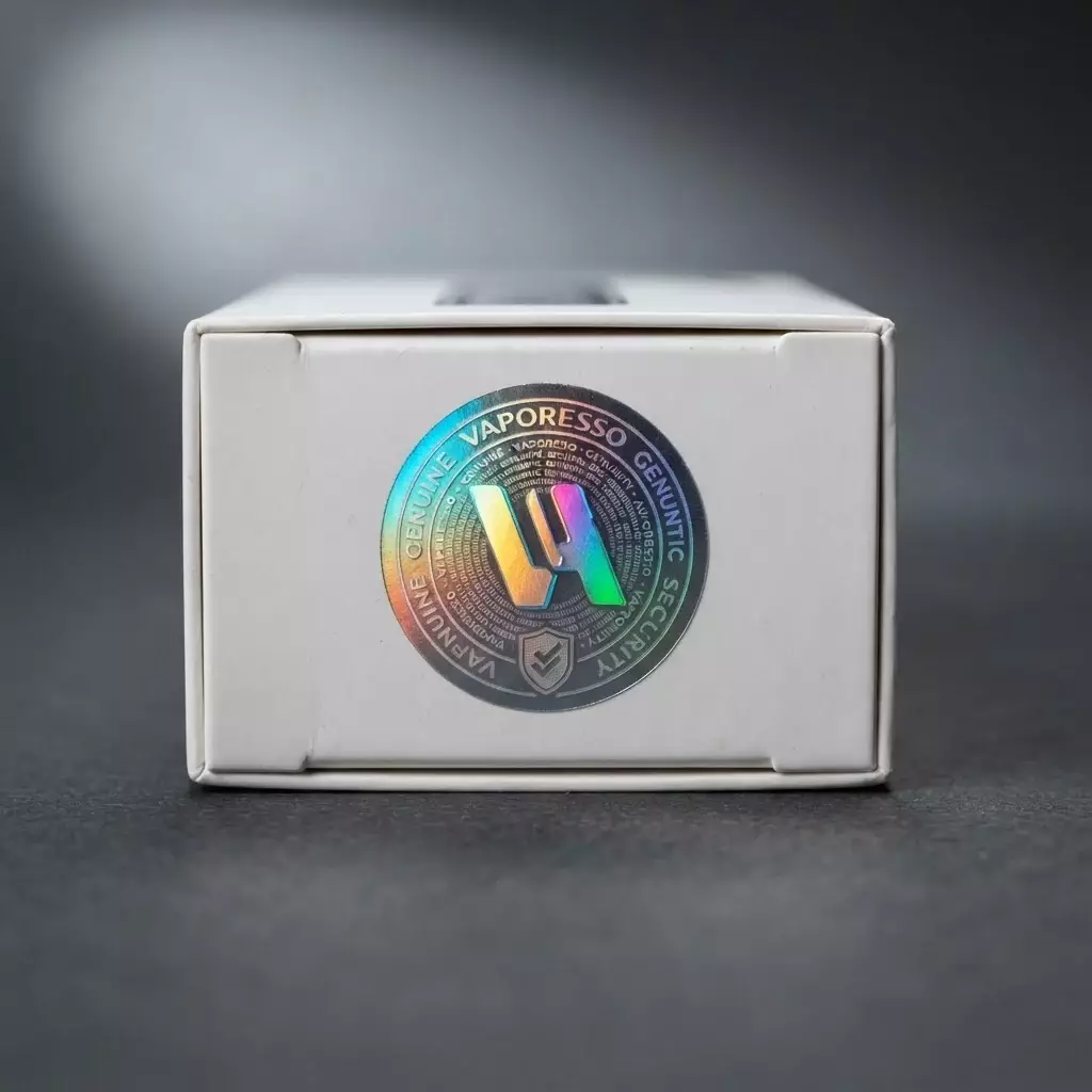 Detailed macro close-up shot of an authentic Vaporesso holographic authentication label under a focused light beam on a cardboard box.