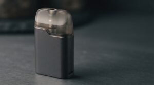 vaper customer stories Bangladesh - adult pod system MTL device on deep slate surface for smokers considering switching
