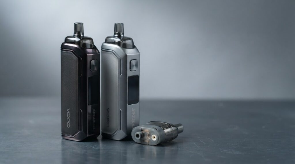Voopoo Argus G3 review -- Midnight Black and Space Gray pod kit with Argus Top Fill Cartridge V2 pods on deep slate surface, studio macro photography