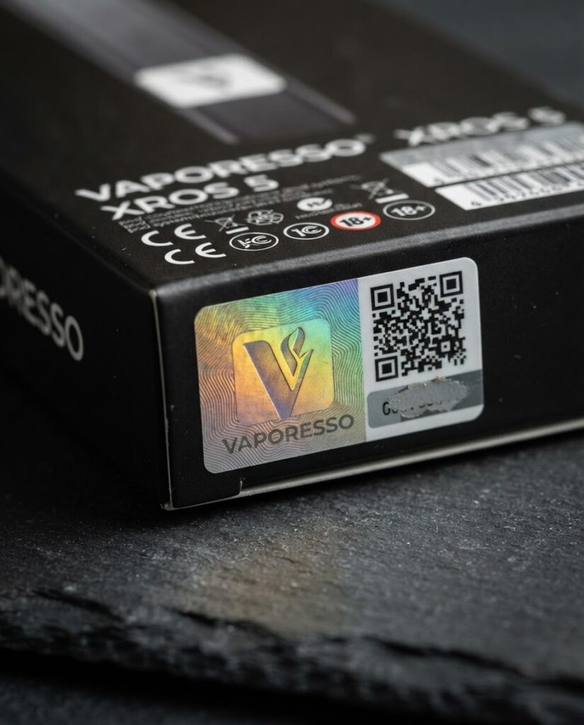 Vaporesso XROS 5 box authenticity sticker showing holographic V mark and QR code location for genuine product verification